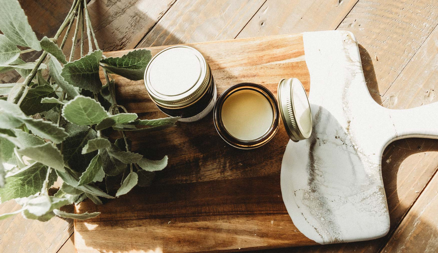 Two jars of Bohemian Rebloom Herbal Tallow Balm with one  jar open.  