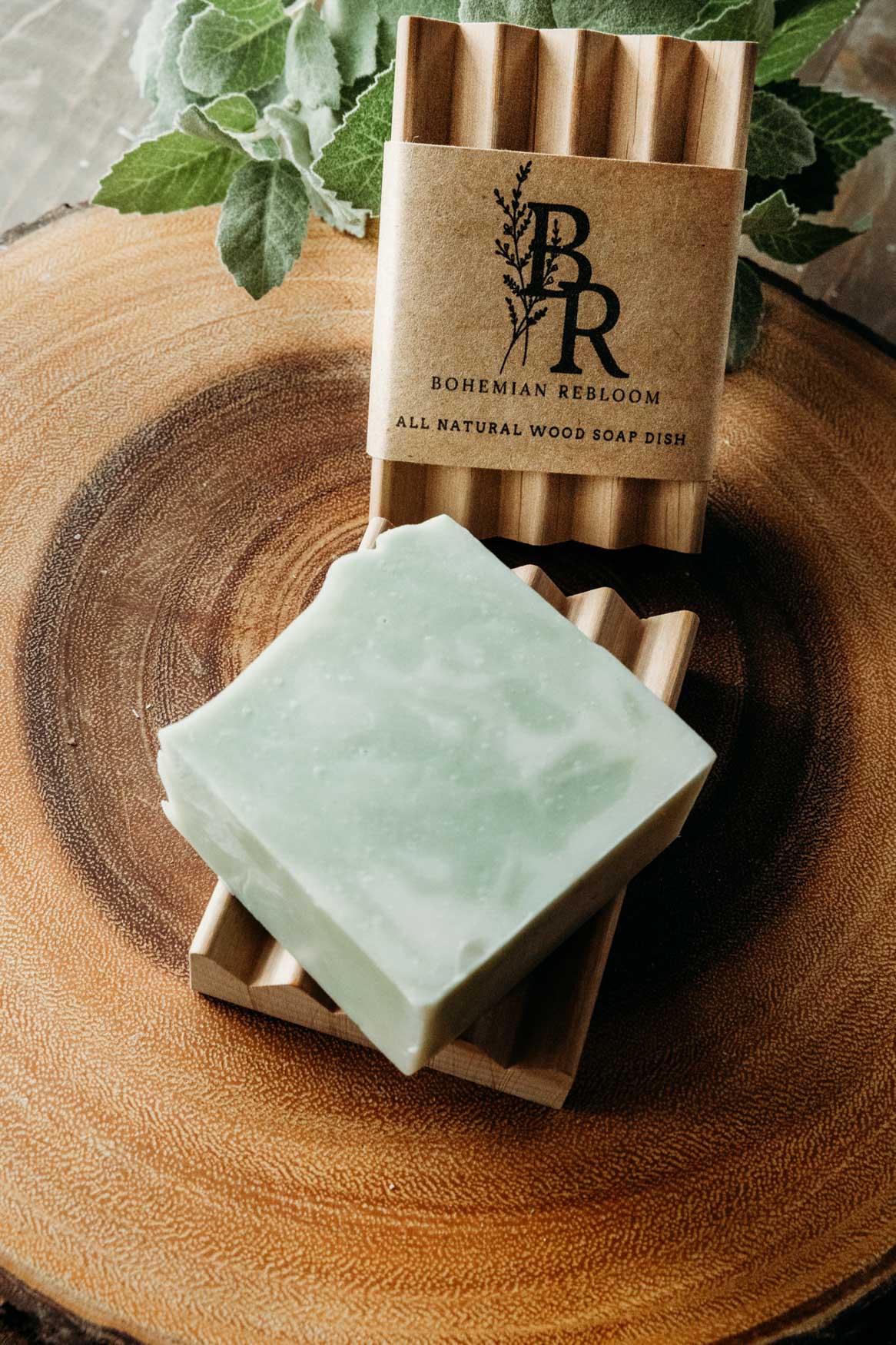 Green soap bars on a wooden soap dish with 'Bohemian Rebel' branding.